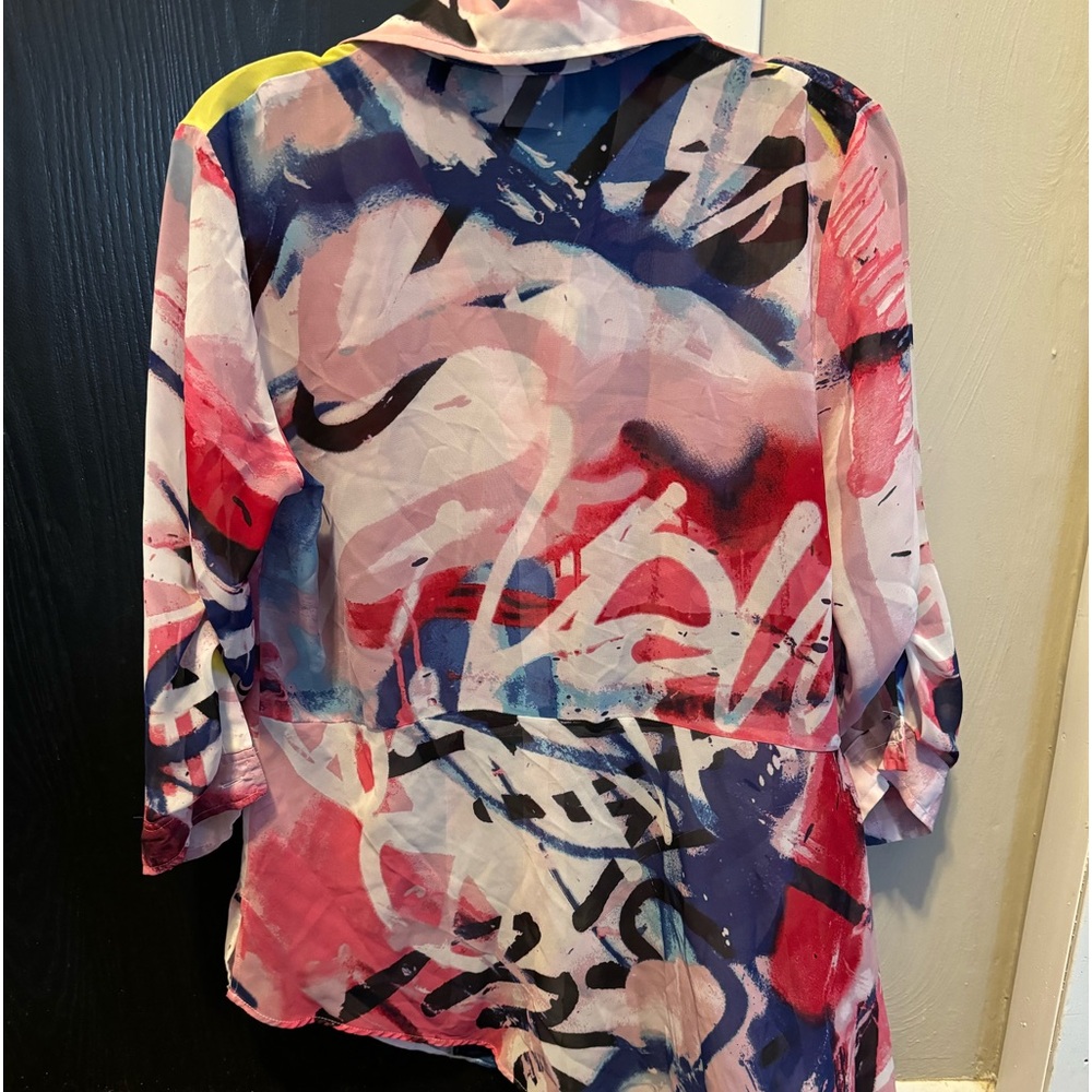 Cute multi color blouse, can be worn many different ways